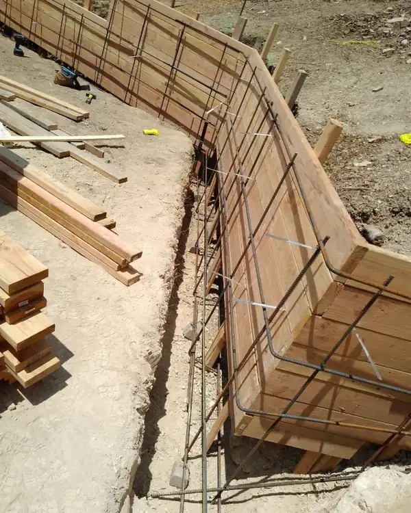 Wood forms and rebar set for a stepped retaining wall